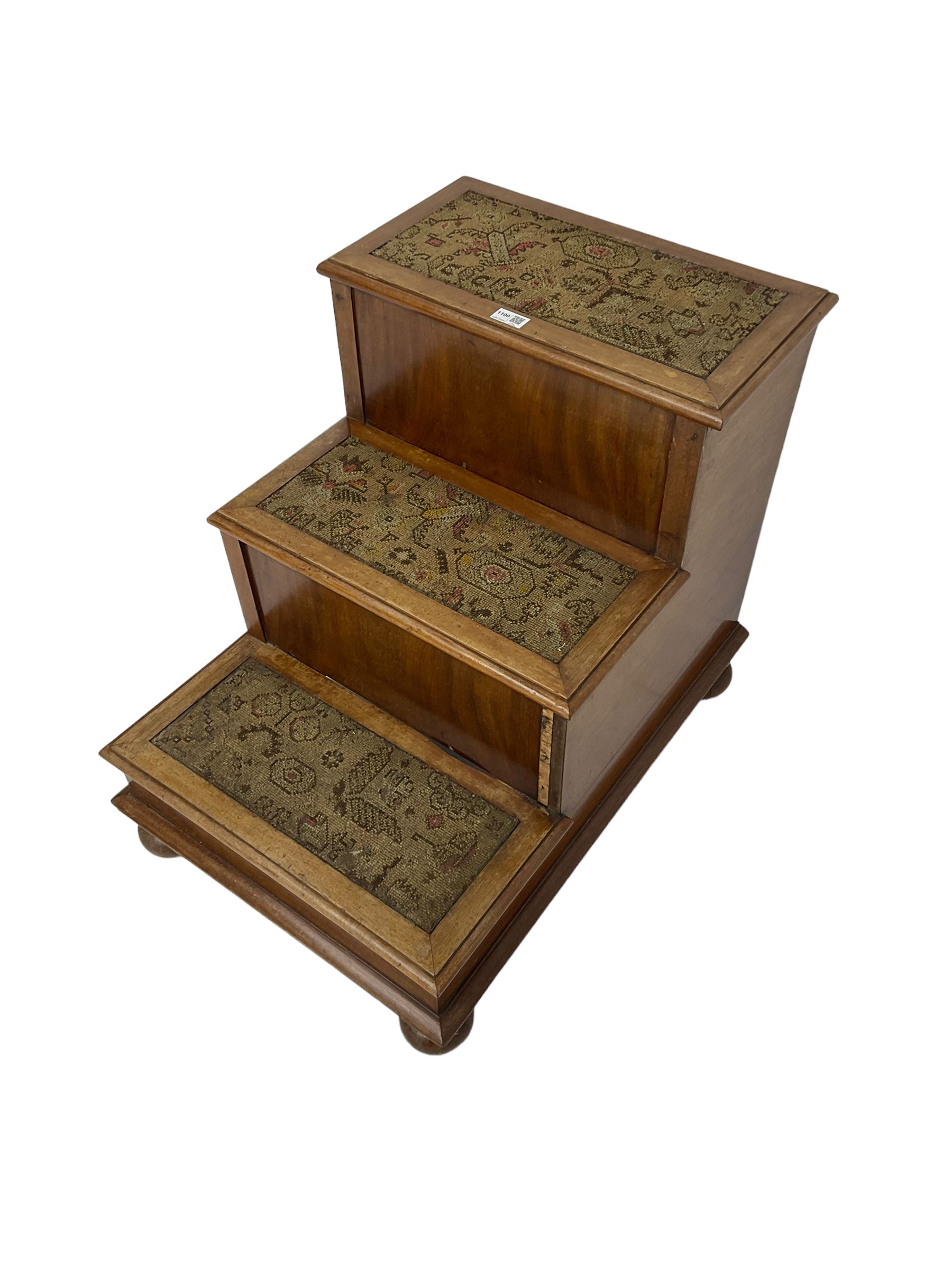 19th century mahogany step commode, pull-out action to reveal commode, the top with hinged lid, on turned feet