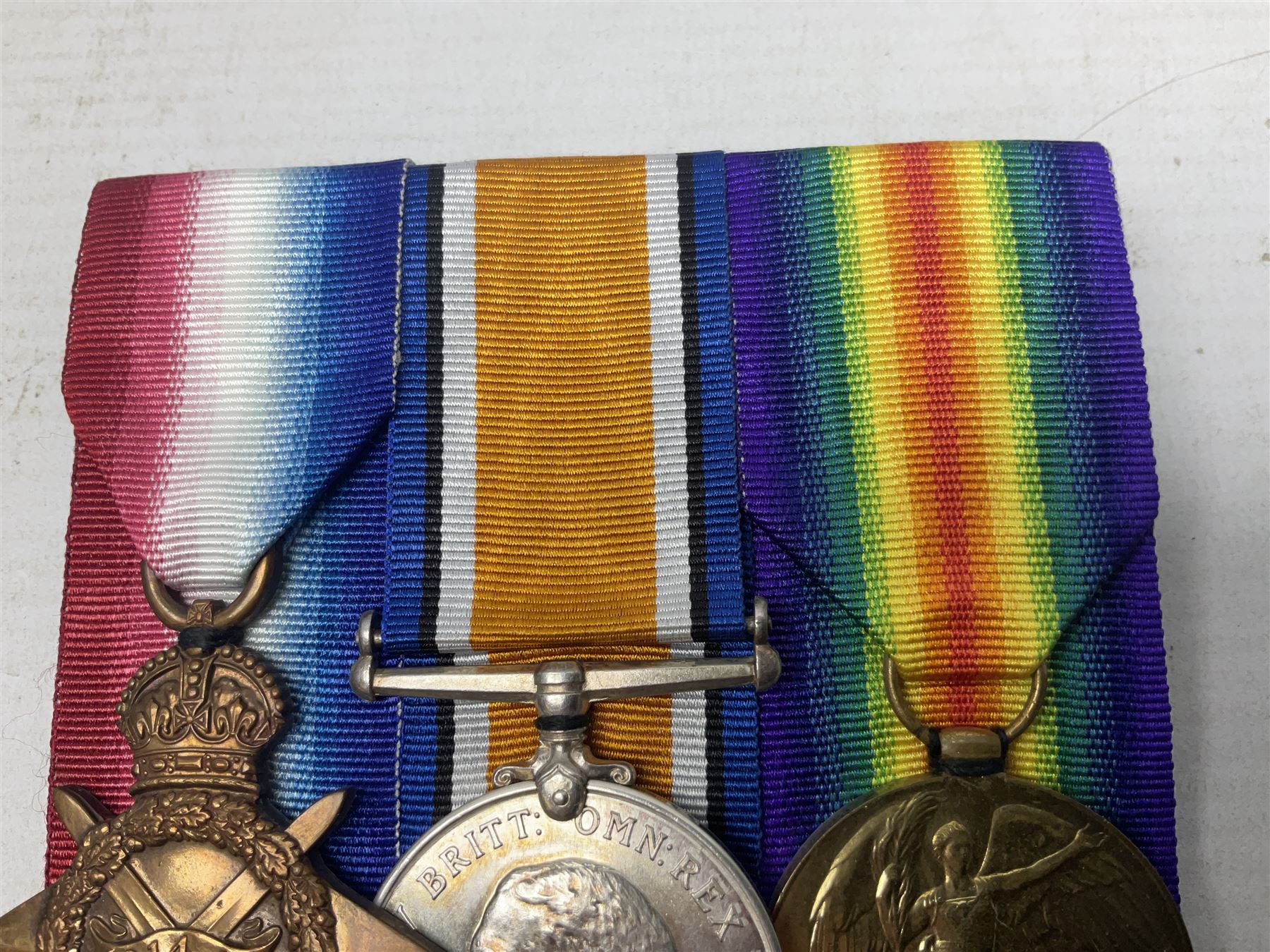 WW1 group of three medals comprising British War Medal, 1914-15 Star and Victory Medal together with bronze Memorial Plaque named to 18397 Pte. E. W. Marchant Y. & L. R.; with ribbons; displayed on modern board for wearing