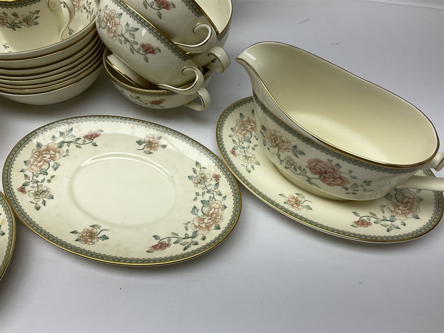 Minton Jasmine pattern tea and dinner wares, including dinner plates, sauce boats, side plates, bowls, teacups, coffee cans and twin handled soup bowls, etc (122)