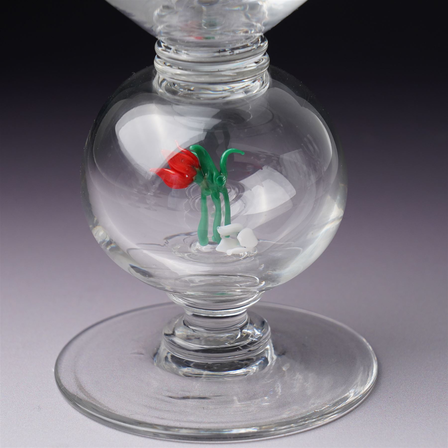 Set of six 1930s glass goblets by William Swingewood for Stevens & Williams, each goblet with lampwork glass stem, the large hollow blown knop containing dog, pair of hounds, horse, raven and two with flowers, H18cm (6)