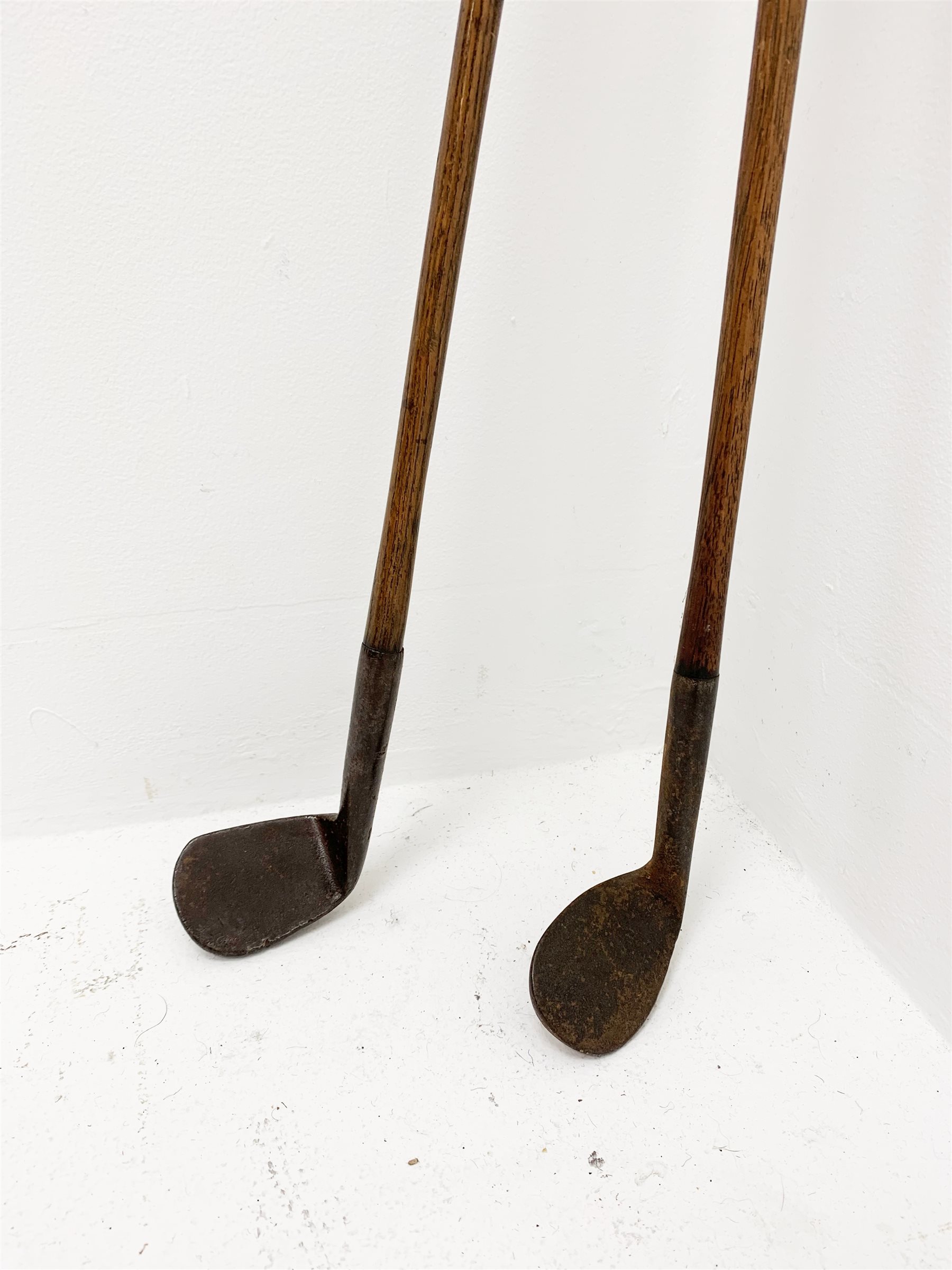 Golf 19th century rut or track type iron with head indistinctly marked NIBLICK, hickory shaft