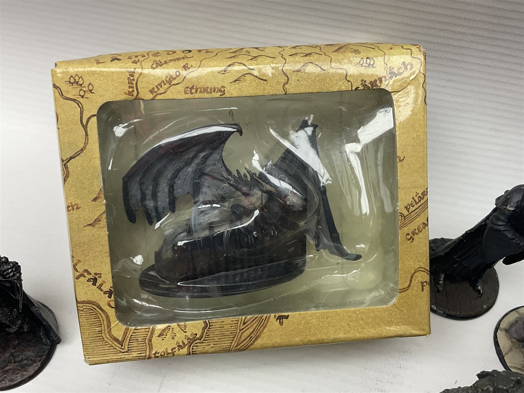 Approximately 80 NLP Lord of the Rings heavy metal painted figurines to include Fell Beast, boxed, and The Watcher, The Dark Lord Sauron, Treebeard etc, and unassociated Dracula themed composite figures marked HHFT50 