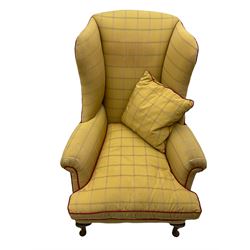 Pair of mid-20th century Georgian design armchairs, high wing backs, upholstered in pale gold fabric
