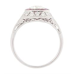 Platinum diamond and ruby cluster ring, the principal transitional cut diamond of approx 0.65 carat, in an octagonal milgrain setting, surrounded by calibre cut rubies, to further round brilliant cut diamonds and a split design shoulders