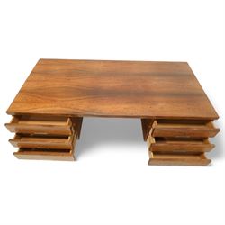 Mid-20th century rosewood pedestal desk, the rectangular top above twin pedestals each fitted with three drawers, all with recessed metal pulls, raised on square legs with stretcher supports and capped metal feet