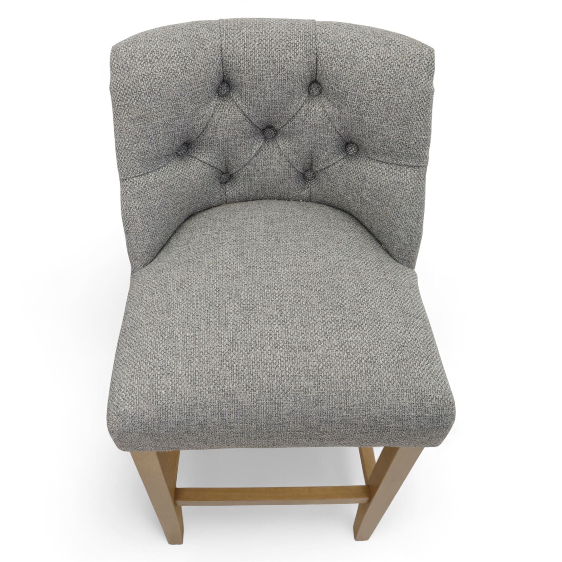 Contemporary set of three upholstered bar stools, each with button-tufted grey fabric backrest and seat, raised on light oak finish square legs united by stretchers