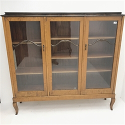 Early 20th century Swedish birch wood triple display bookcase, three glazed doors enclosing two shelves, cabriole feet, W153cm, H147cm, D35cm