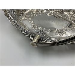 Edwardian silver swing handled basket, of navette form, with four repousse lion masks to each corner and with pierced and embossed floral, scroll and shell decoration to sides, base and handle, hallmarked Charles Horner, Birmingham 1906, height including handle H20cm