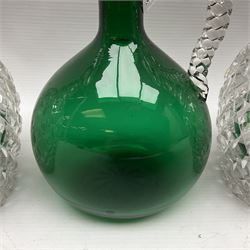 Pair of Victorian style cut glass decanters, each with silver collars, together with a Victorian green glass claret jug, with plaited clear glass handle and faceted stopper, tallest H26cm