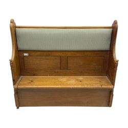 Early 20th century waxed pine pew, inset upholstered striped back panel with hinged box seat enclosing storage, shaped arms and turned supports