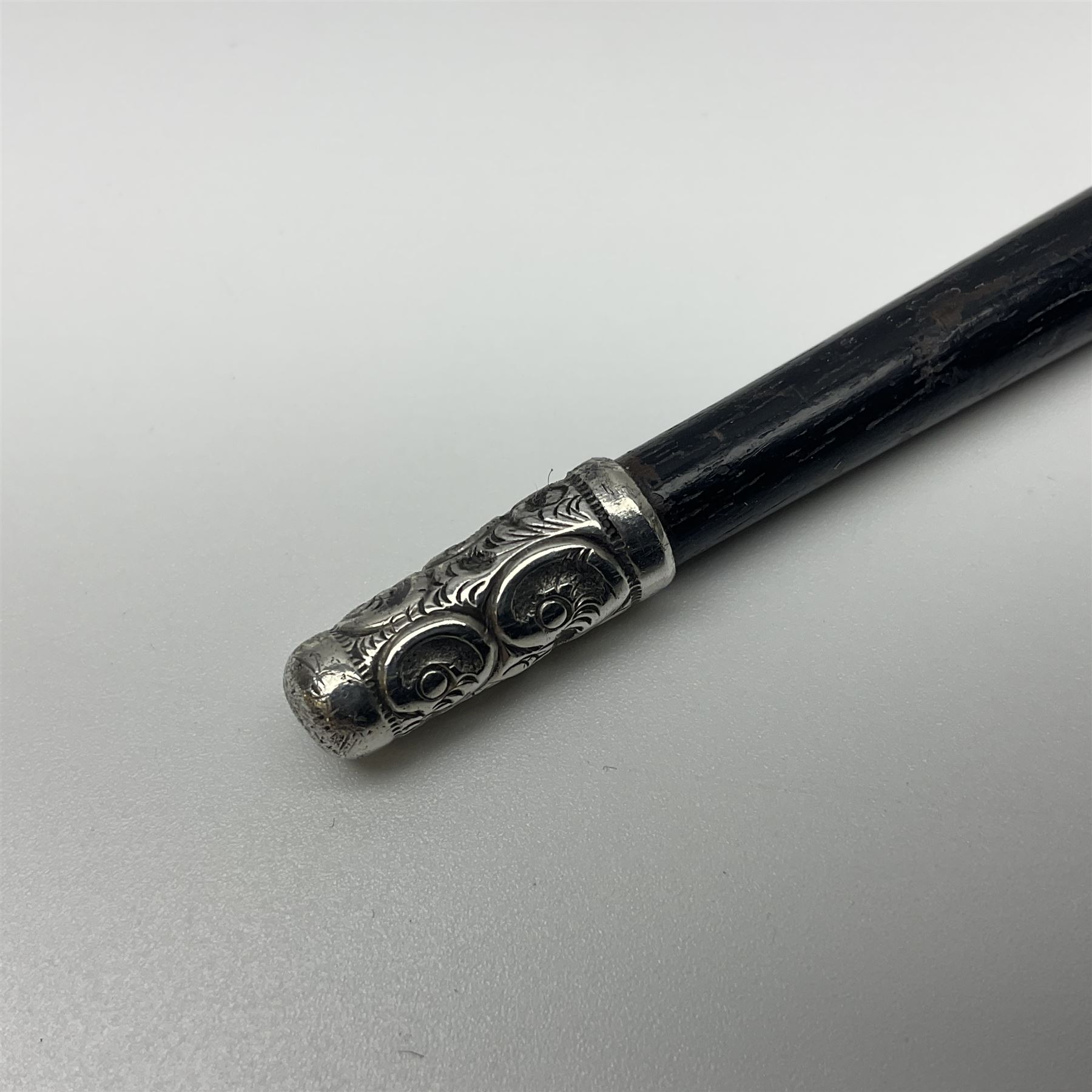 Two early 20th century conductor's ebonised batons each with three silver mounts; one hallmarked London 1915 with presentation plaque 'I.O.R. Presented to Mr. J.R. Maddock 4.1.17' L52cm; the other hallmarked Chester 1908 with vacant cartouche L51.5cm (2)