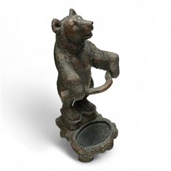 Early 20th century Black forest bear design stick stand, composite wood model of a bear with arms outstretched holding a branch forming the stick stand above a drip tray on tree branch form feet 