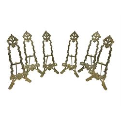 Set of six ornate cast brass easel stands, H30cm