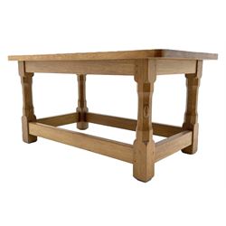 'Rabbitman' oak coffee table, rectangular adzed top on octagonal supports joined by plain stretchers, with carved rabbit signature, by Peter Heap of Wetwang