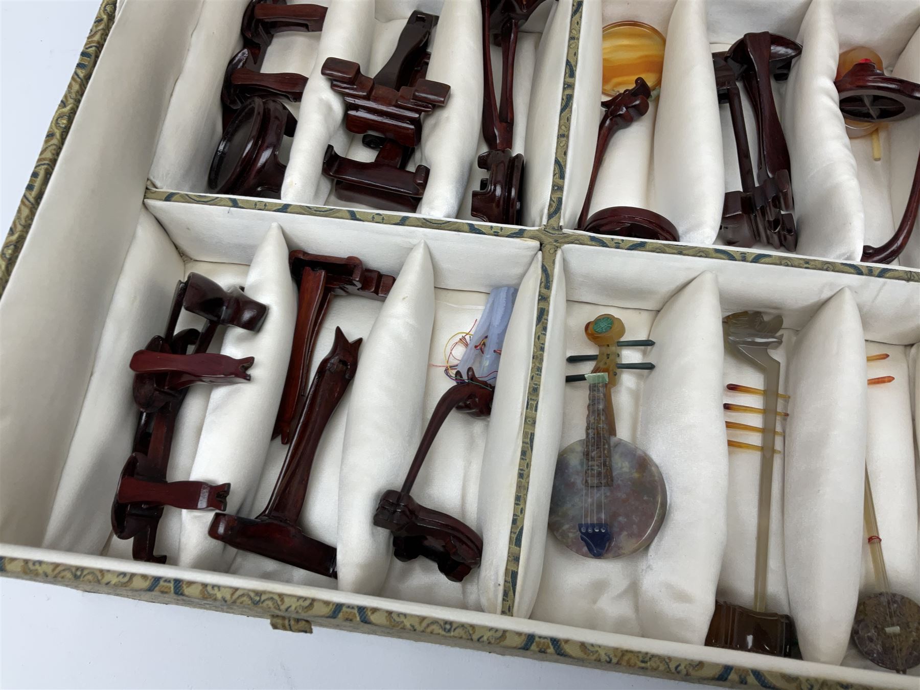 Chinese boxed collection of miniature polished hardstone musical instruments with hardwood stands
