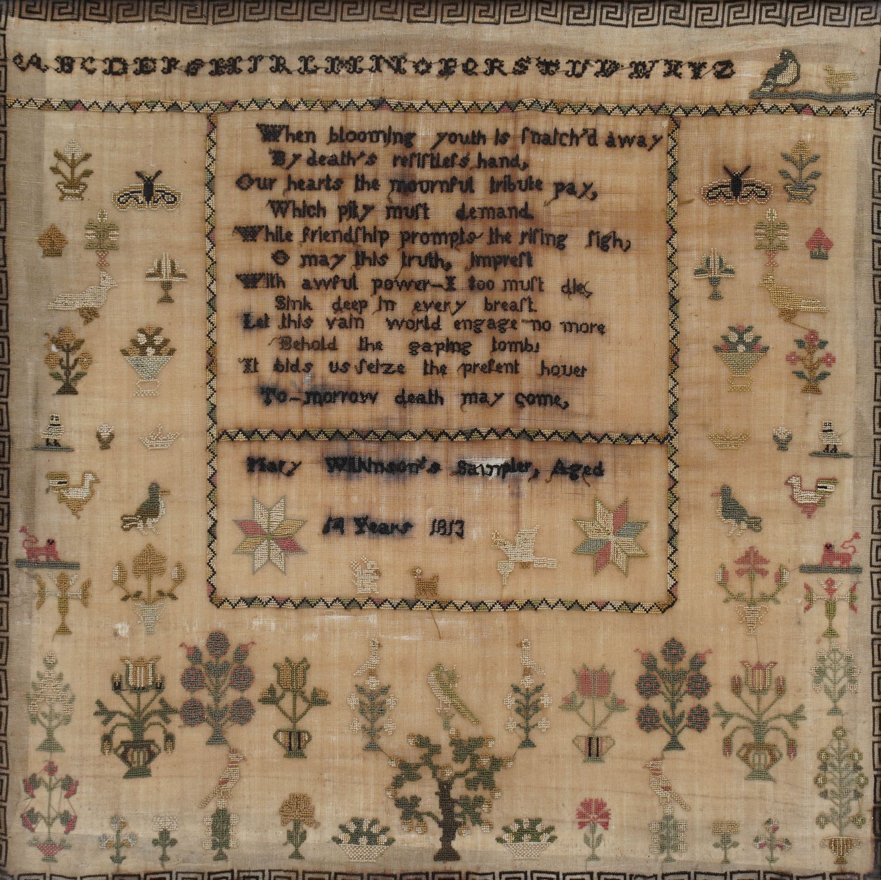 George III silk work sampler by Mary Wilkinson aged 14, dated 1813, finely worked with verse 'When blooming youth is match'd away, By death's resistless hand, Our hearts the mournful tribute pay, Which pity must demand, While friendship prompts the rising sigh, O may this truth impress, With awful power - I too must die, Sink deep in every breast, Let this vain world engage no more, Behold the gaping tombs, It bids us seize the present houer, To-morrow death may come', decorated with various floral and animal motifs, including ducks and moths, within Greek key border, 38cm x 38cm  