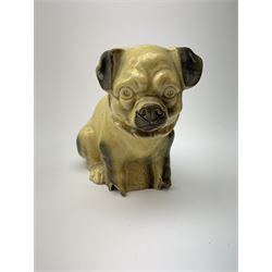 A collection of various ceramic figurines, to include pair of small 19th century Staffordshire cats, Royal Doulton cat, Coalport cat, pair of 19th century pug dogs, two fairings inscribed Good Templars, two Bonzo dog peppers, a number of pin cushion dolls, various 20th century and later black pottery cats, Victorian bisque figures, etc. 