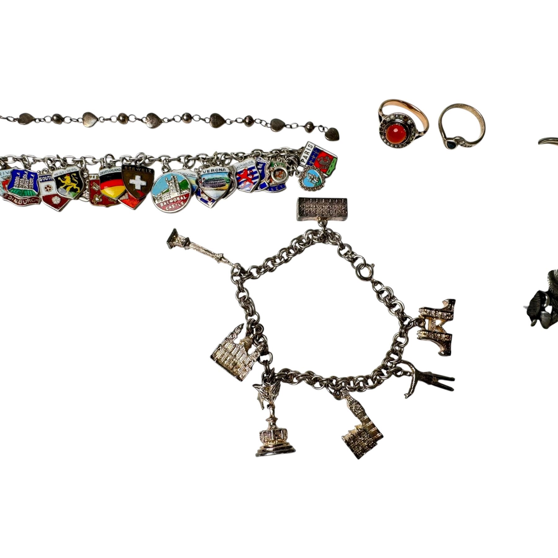 9ct gold stone set ring and silver enamel town badge charm bracelet, cross pendant, ring and heart link bracelet, and a collection of costume jewellery