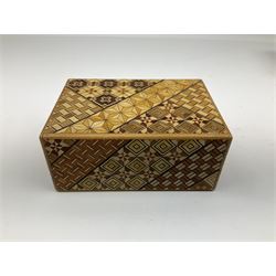 Japanese parquetry puzzle box L12cm; another Japanese puzzle box with marquetry top of Mount Fuji; eleven graduated Chinese figures including immortals; and Chinese figure of a lady standing on a hardwood base next to a horn table (14)