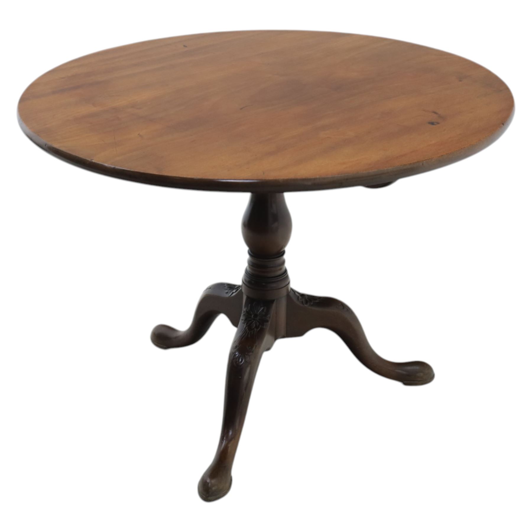 19th century quality mahogany tripod table, the circular tilt top supported on a turned baluster column with downswept cabriole legs carved with flower heads and terminating in pad feet