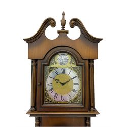 A 20th century “Grandmother” longcase clock in a light mahogany simulated case with a full-length glazed door displaying three brass cased weights and pendulum, brass dial with a slivered chapter ring and pierced steel hands, with an chain driven eight-day three train movement.


