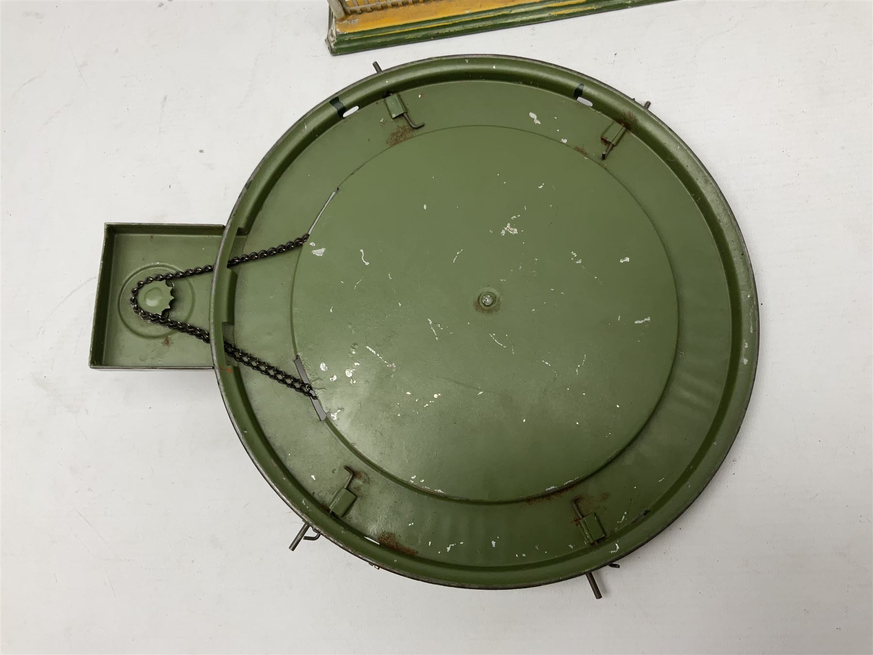 '0' gauge - Bing tin-plate two-storey double sided station with open walk-through to one end, rail side canopy, hinged doors and removable roof giving access to clock illumination L35cm; Bing hand-cranked turntable and open wagon; Marklin tin-plate level crossing barrier and Newspaper vendor's tin-plate four-wheel hand cart (5)