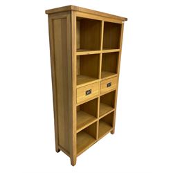 Light oak eight compartment bookcase with two drawers
