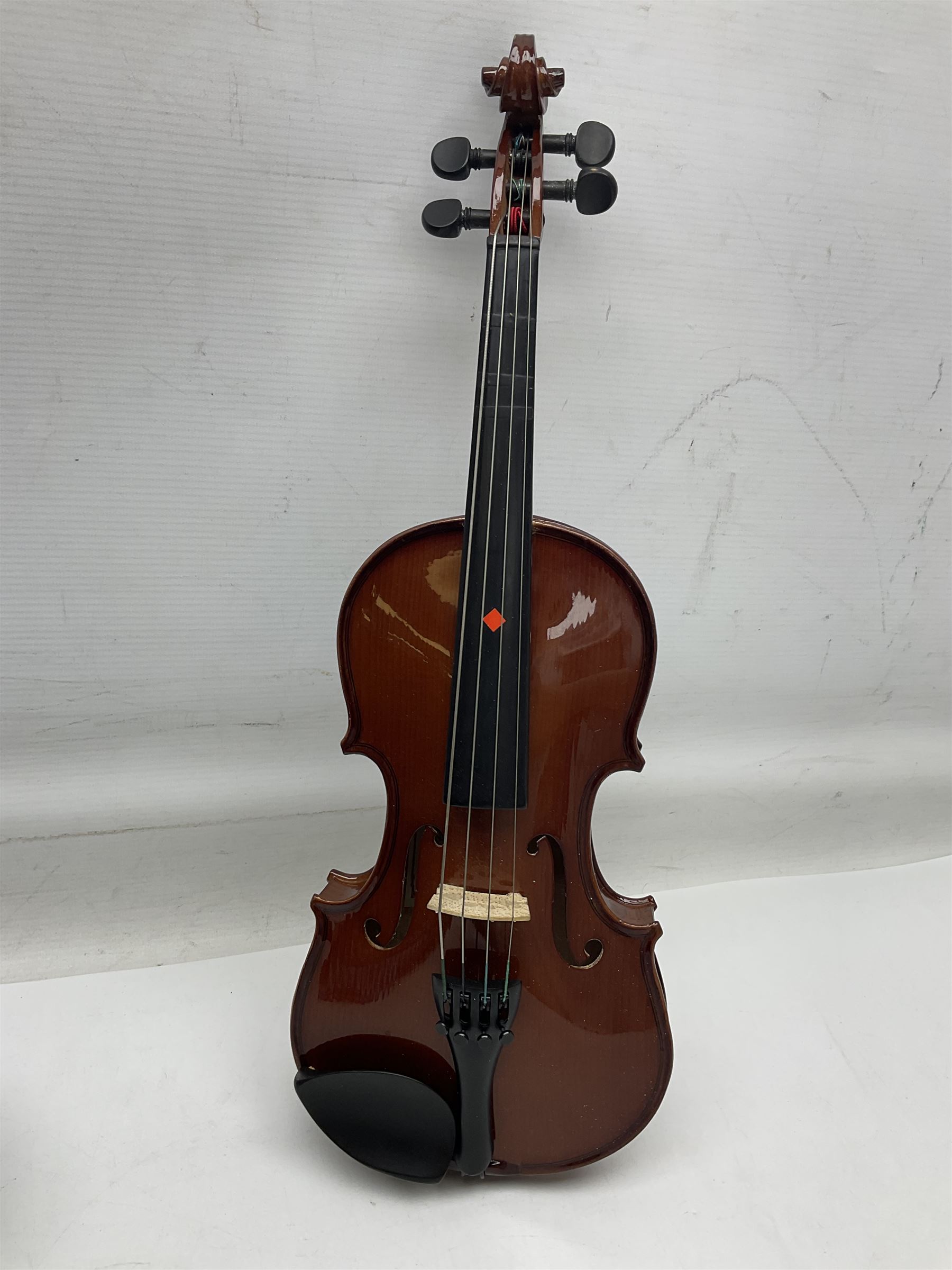 Four student violins - two Chinese three-quarter size with 33.5cm and 34cm two-piece backs; Stringers of Edinburgh quarter size with 28cm two-piece back; and Stentor quarter size with 28cm two-piece back; each in carrying case (4)