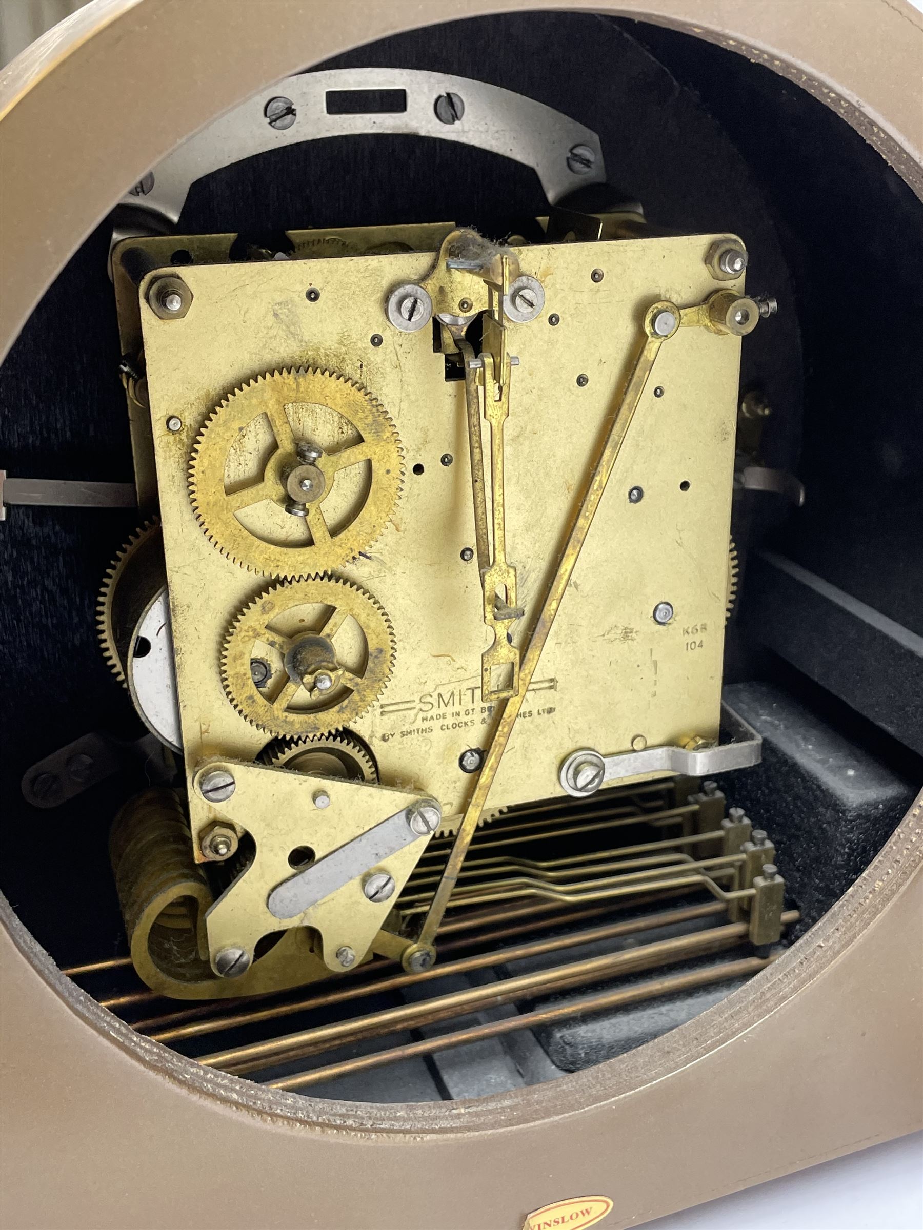 Mid 20th century walnut cased mantel clock by 'Smiths', circular dial with Arabic chapter ring, triple train driven movement with Westminster and Whittington chimes, chiming the quarters and striking the hours on rods, silent chime and West Whitt levers