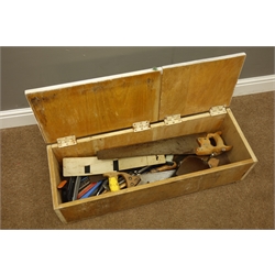  Various tools in wooden tool box including - variety of hand saws, hand drill, hammers etc...  