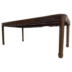Late 20th century Chinese carved hardwood extending dining table, rectangular panelled top with rounded corners over a pierced frieze carved with dragon motifs and scrolling foliate decoration, with two additional leaves