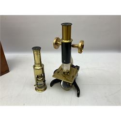  Brass field microscope, together with a cased microscope and twenty five microscope slides