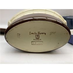 Emile Henry covered casserole dish of oval form in two tone brown and cream, no. 03.06, together with cast iron Nomar twin handled lidded casserole dish of oval form in navy, and other ovenware including Flintware ICTC, largest L35cm