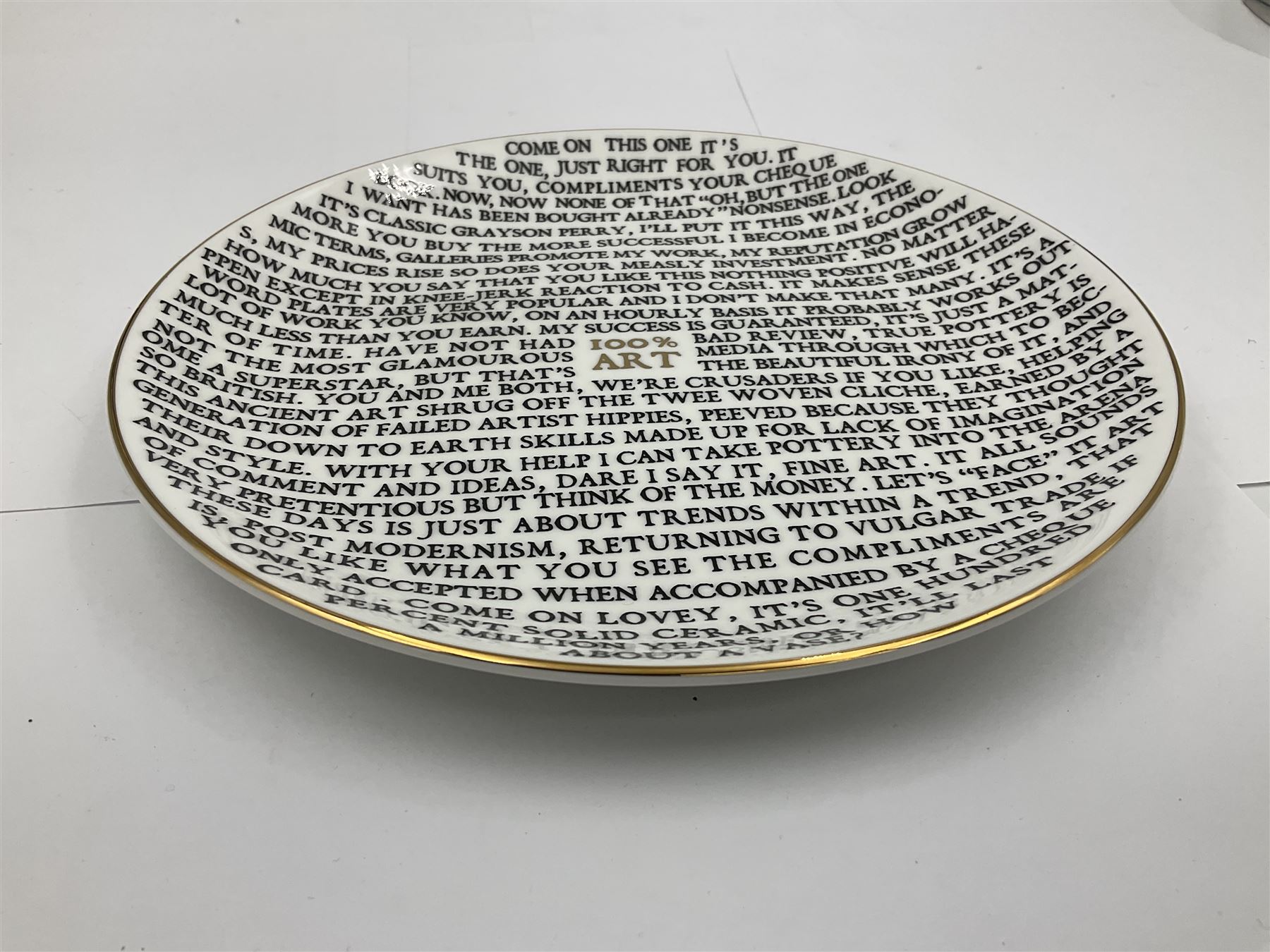 Grayson Perry (British 1960 -): ‘100% Art’, set of three ceramic plates, each with artist's seal printed to base and individually marked either with York Art Gallery, Sainsbury Center or The Holburne Museum
