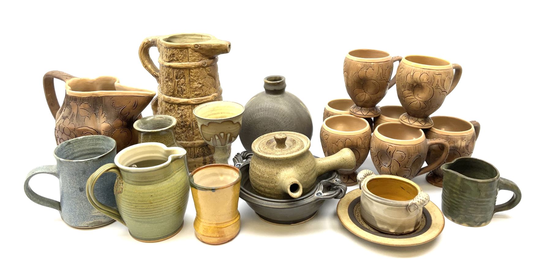 Studio pottery, to include Borgh pottery twin handled bowl, Hillstonia naturalistically modelled jug, set of seven mugs, jug and two vases.
