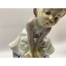 Three Lladro figures, comprising Boy from Madrid no 4898, Nature Bounty no 1417 and Purrfect Friends no 6512, all with original boxes, largest example H24cm