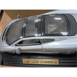 Maisto Jaguar XJ220 model car on stand and a collection of diecast model vehicles, including Vanguards, Unigate and Lledo examples