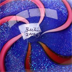 Geoffrey Beetem glass marble, pink and red spiral on a blue ground, signed to base, H5cm 