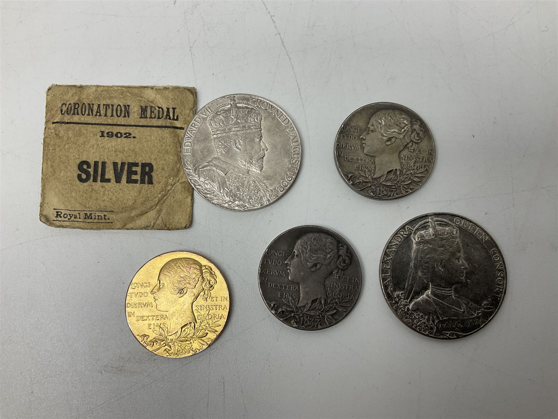 Commemorative medallions or medals including three Queen Victoria Diamond Jubilee small silver medallions, two King Edward VII 1902 Coronation medallions and a Queen Elizabeth II 1953 Coronation medal in red box