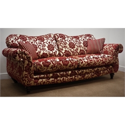  Two Grande sofas upholstered in embossed a red and gold fabric with complimentary scatter cushions and arm-covers, W220cm  