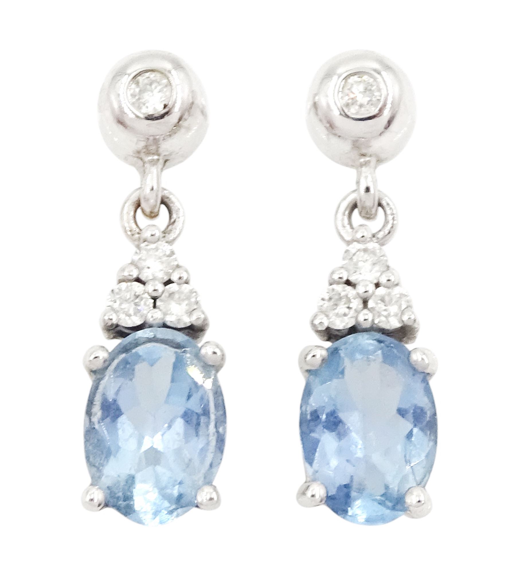 Pair of 9ct white gold oval cut aquamarine and round brilliant cut diamond stud earrings, hallmarked