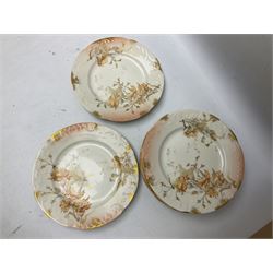 Early 20th century Limoges part tea service, decorated with floral sprays and gilt on merging peach and white ground, comprising six teacups, twelve side plates, six smaller plates, milk jug, open sucrier, slop bowl and two cake plates, many marked R Delinieres Limoges D&C France to base