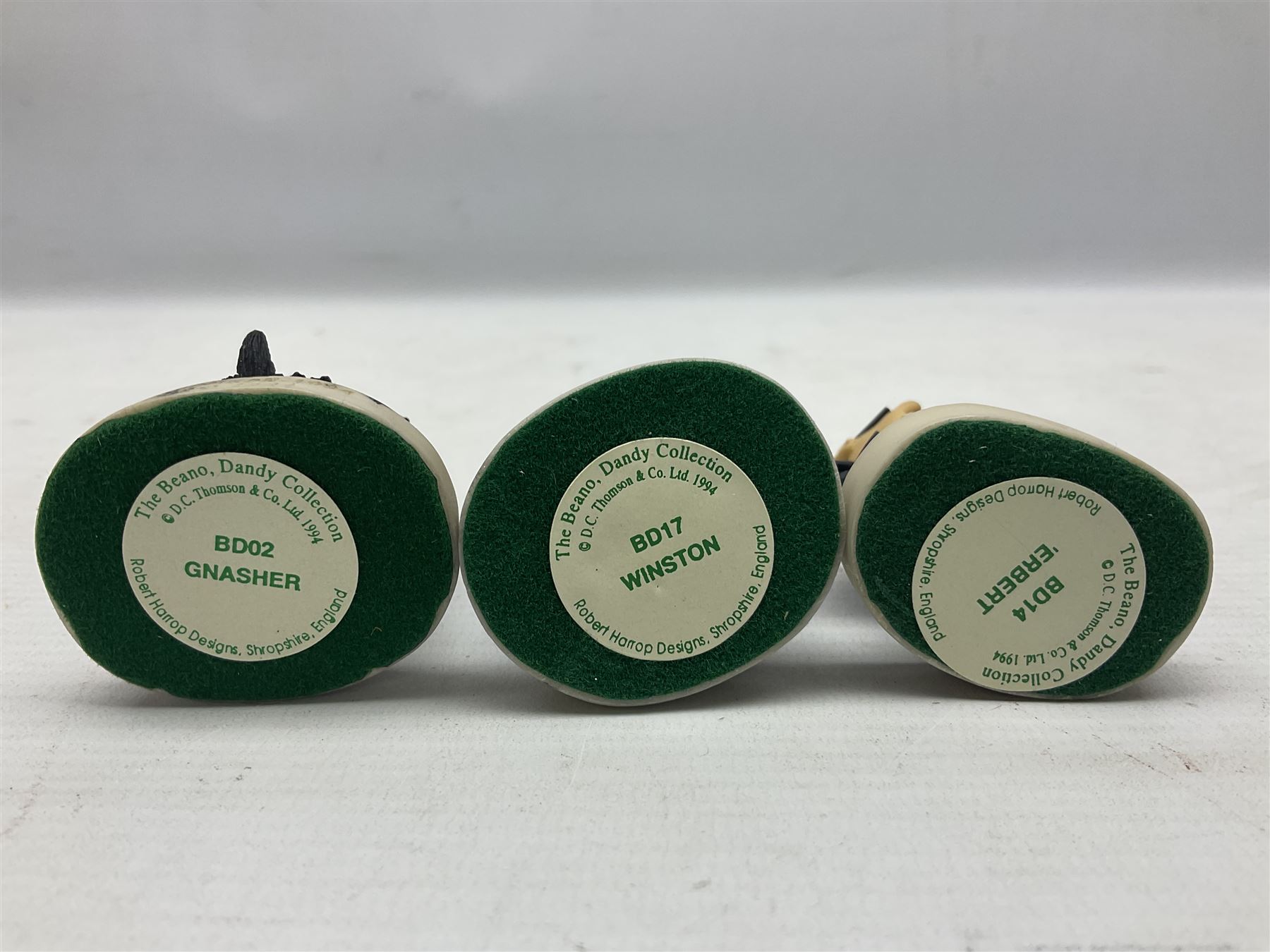 Fourteen Robert Harrop figures from the Beano Dandy collection, comprising Minnie the Minx BD04, Danny BD10, Biffo the Bear BD19, Spotty BD16, Smiffy BD09, Oops! BDS01, Little Plum BD27, Wilfrid BD15, Danny BD10, Winston BD17, 'Erbert BD14, Gnasher BD02, Beryl the Peril BD05 and Desperate Dan BD03, all with boxes