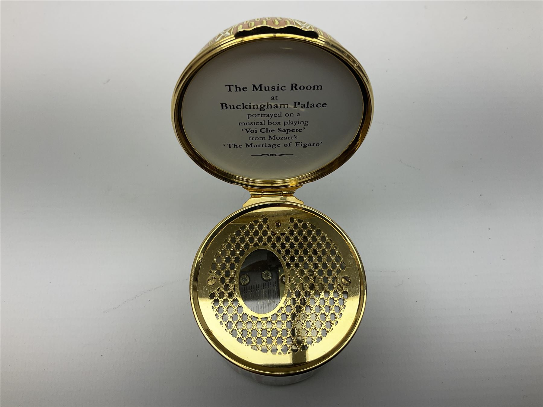Cylindrical music box with domed lid depicting the Music Room at Buckingham Palace and playing Mozart's 'Voi Che Sapete', limited edition 187 of 250, boxed, together with enamel box for the silver jubilee and a victorian paperweight of Scarbrough  