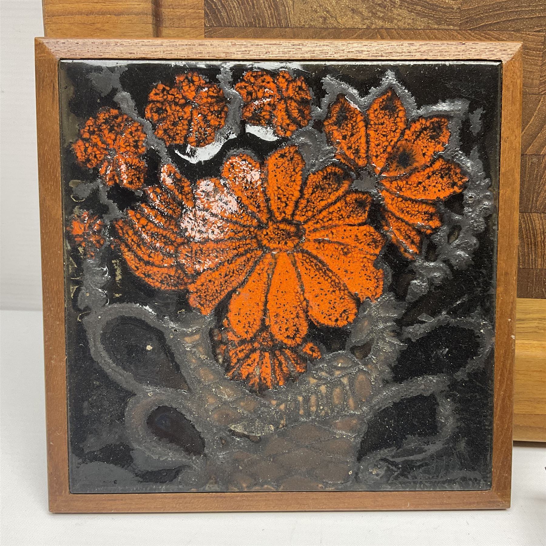 Danish collectables, to include teak tray by Nissen Denmark, ladybird pattern biscuit barrel by Laurids Lonborg and a Stelton stainless steel and wooden cruet set, together with a mid century floral tile trivet