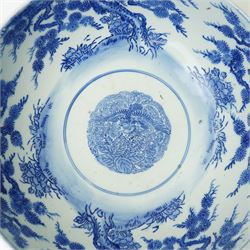 Japanese blue and white bowl, the central bowl painted with bird, surrounded by a border of trees, unmarked, D31cm 
