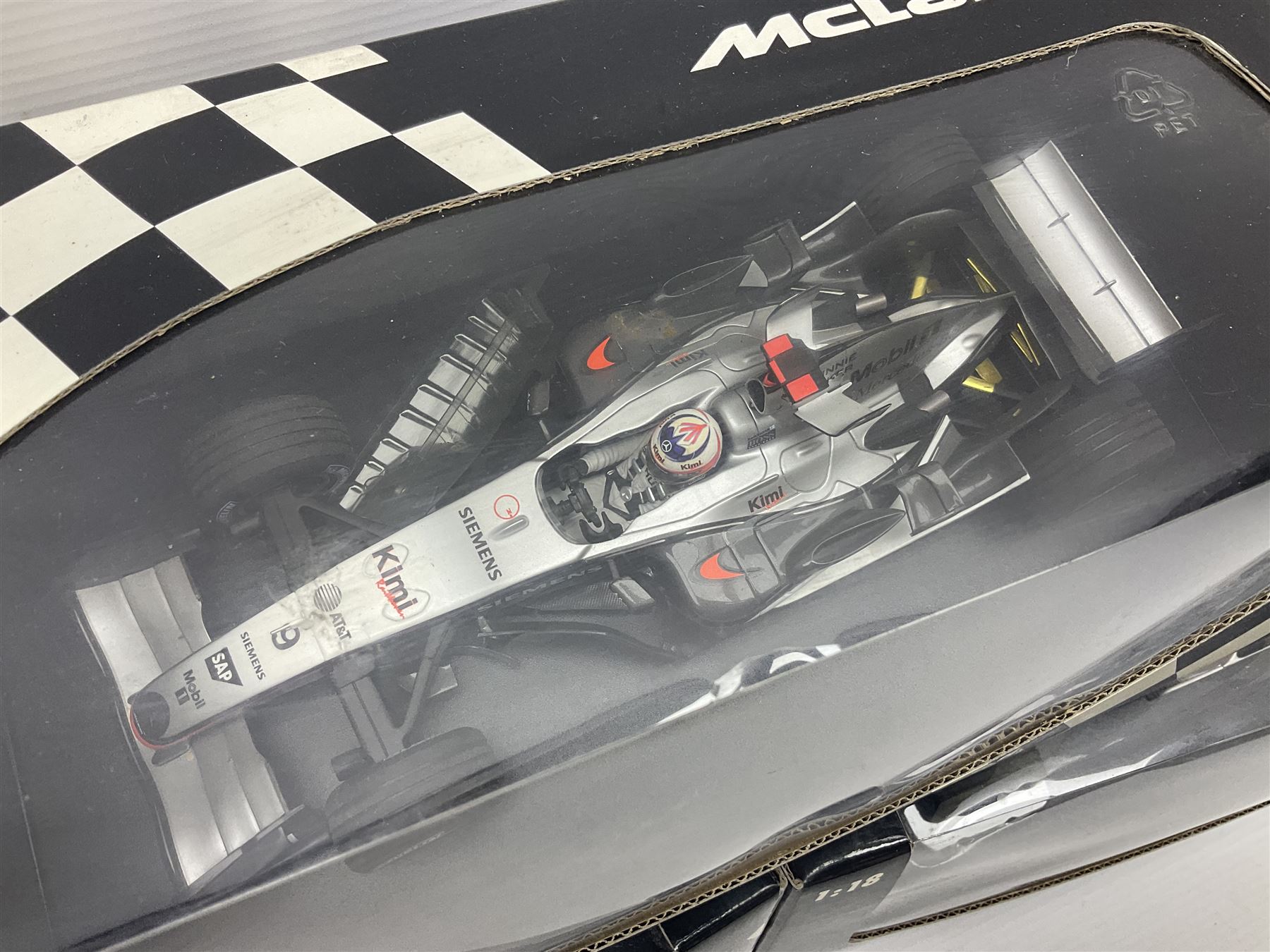 Three Minichamps 1:18 scale die-cast McLaren racing cars - Mercedes MP4-19 D. Coulthard; Mercedes MP4-20 K. Raikkonen; and Vodaphone Mercedes MP4-22 L. Hamilton 2007; all boxed (3)

