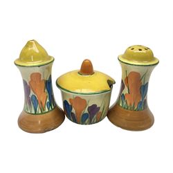 Clarice Cliff Bizarre for Newport Pottery, Muffineer cruet set in Crocus pattern, comprising mustard pot, salt shaker and pepper shaker, with printed marks beneath  