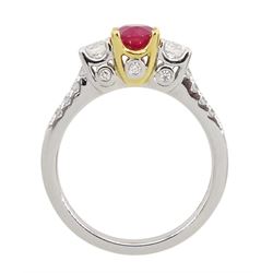 18ct white gold three stone oval ruby and round brilliant cut diamond ring, with diamond set shoulders and gallery, stamped 750, ruby 0.89 carat, total diamond weight approx 0.55 carat