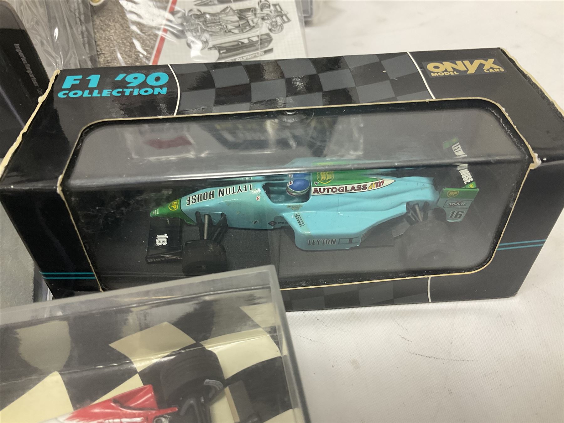 Panini Formula 1 The Car Collection - twelve die-cast models including ten in unopened packaging with periodical; all models in plastic display boxes; and eight other boxed die-cast models of racing cars by Corgi, Onyx, Classico, Minichamps etc (20)